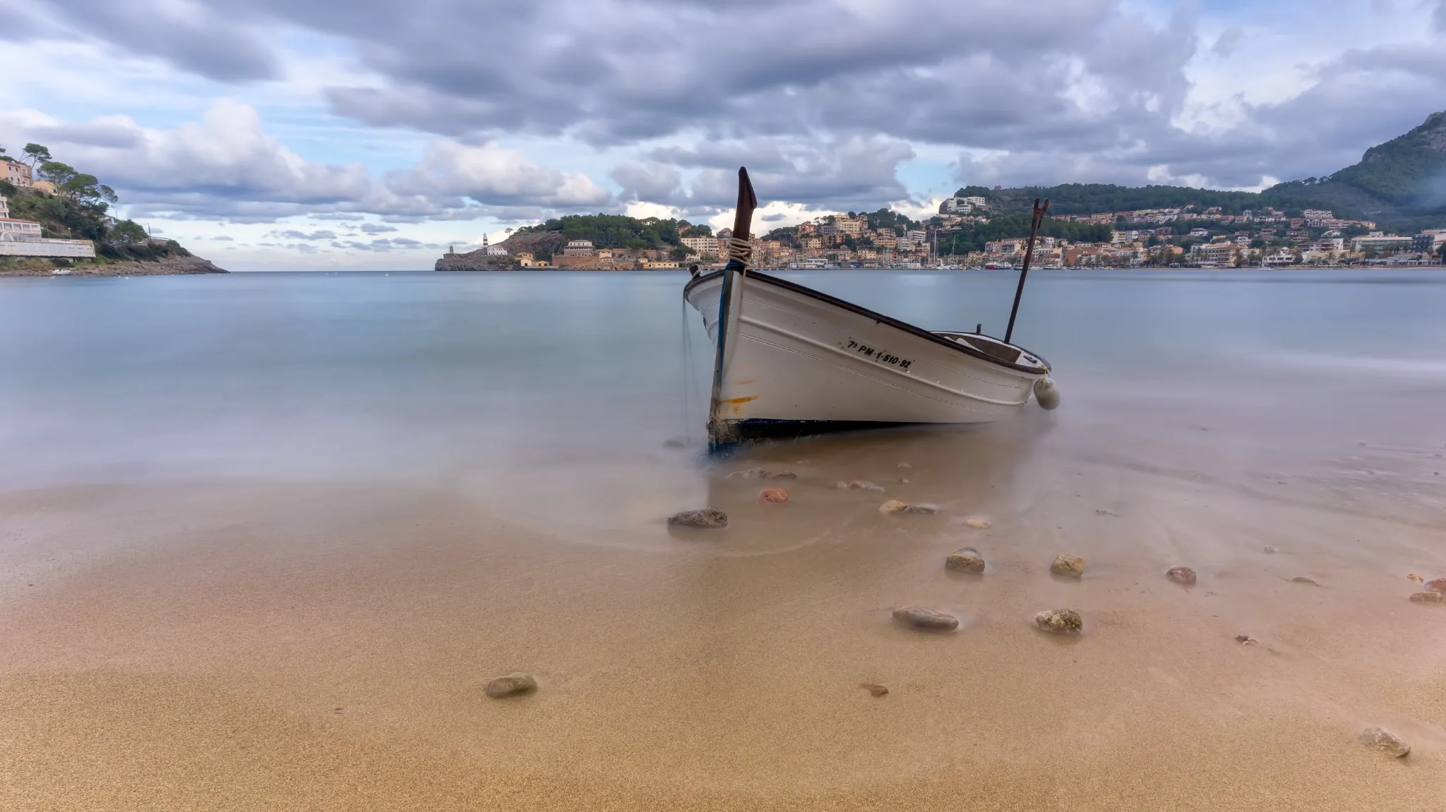 Traditional boat and calm Mediterranean waters in Port de Sóller